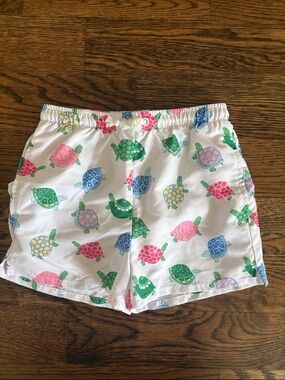 Little English White Swim Shorts with Yellow, Blue & Green Turtle Accent